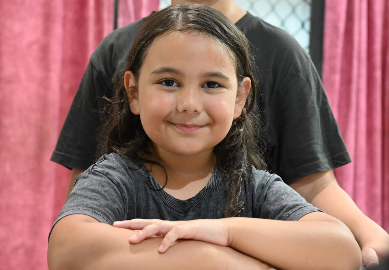 Brooklyn Liddle poses in her new family kitchen