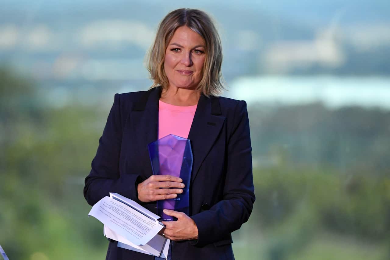 A woman, Shanna Whan, is pictured receiving an award during the Australian of the Year Awards in Canberra. 