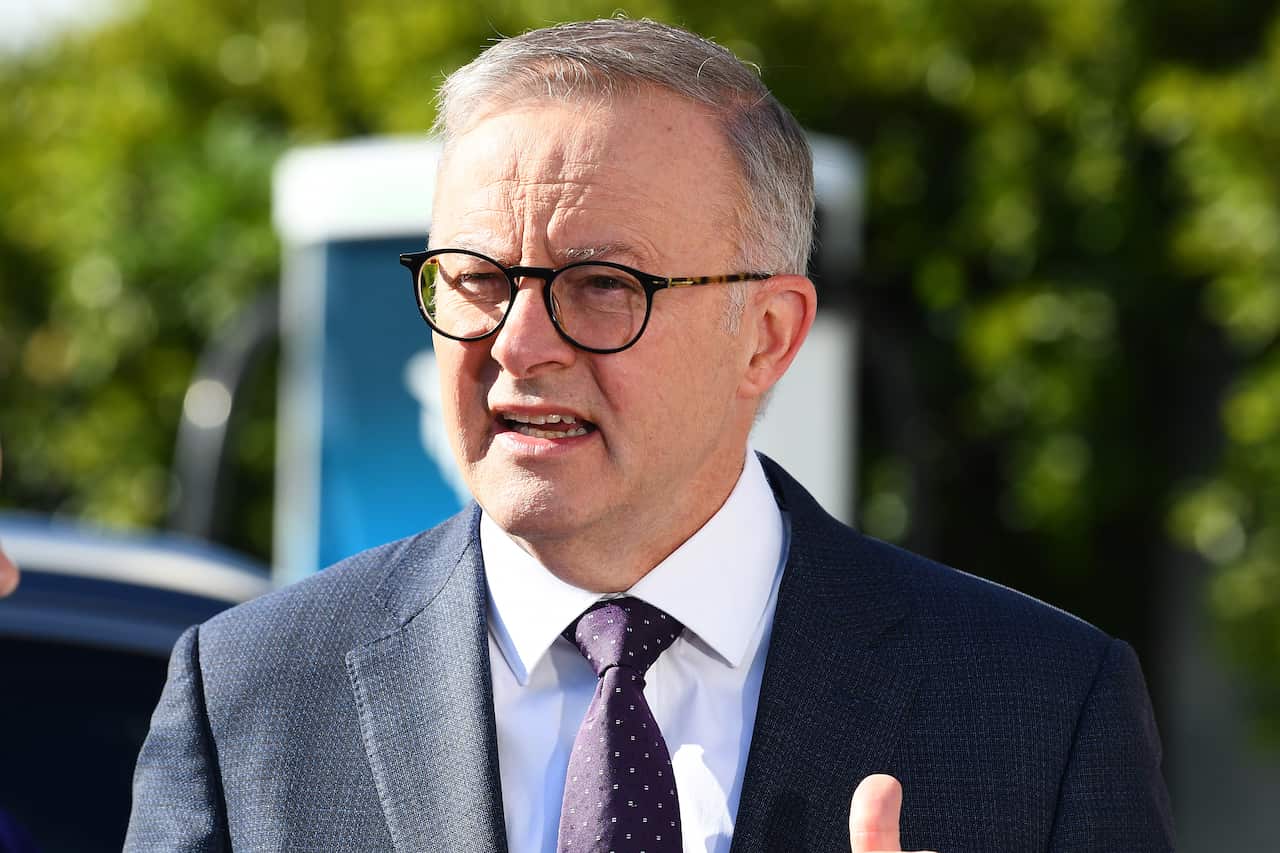 Anthony Albanese wearing a suit at a press conference