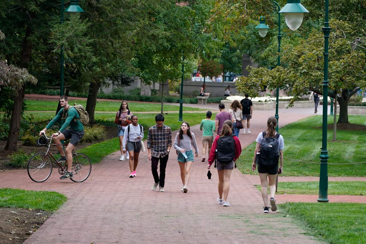 Young people walking at the university campus