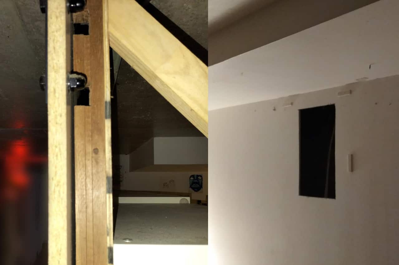 On the left, makeshift walls put together from thin pieces of wood. On the right, a hole in a wall