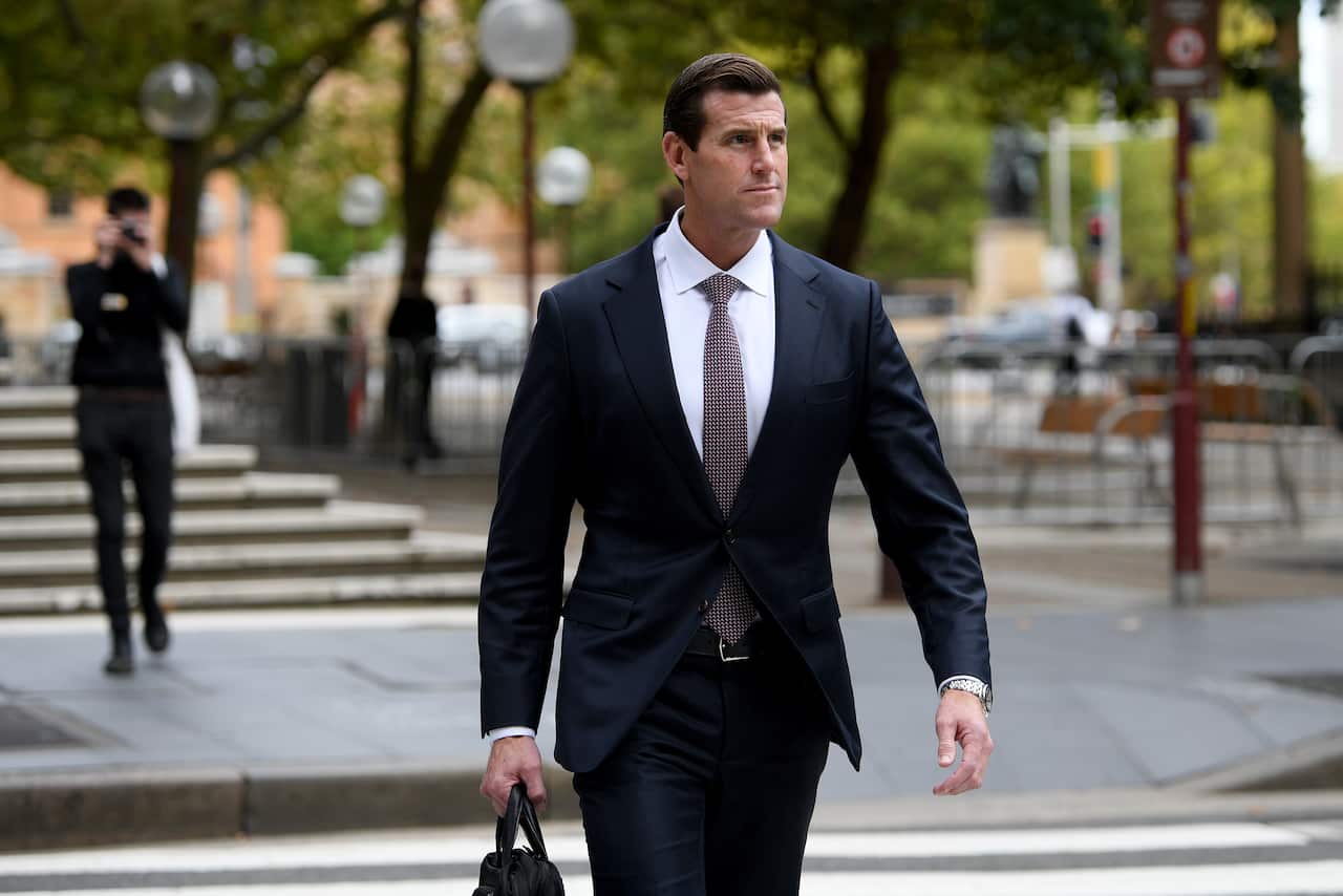 Ben Roberts-Smith wearing suit walking outside 