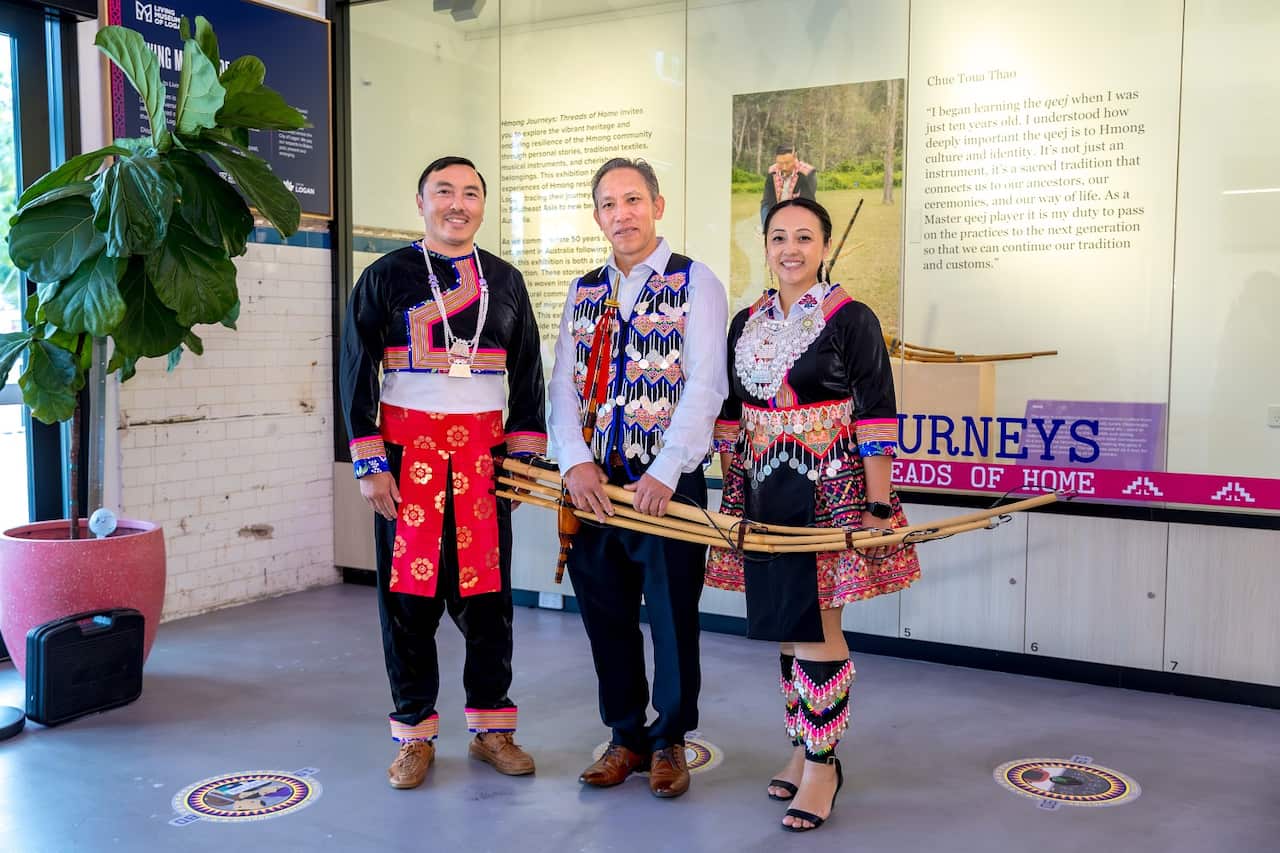 Bee Thao, Gia Xa Chang and Sarah Thao in Hmong traditional clothing at the opening of the new exhibition.jpg