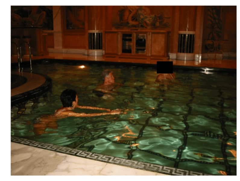 Bill Clinton and Ghislaine Maxwell in a swimming pool 