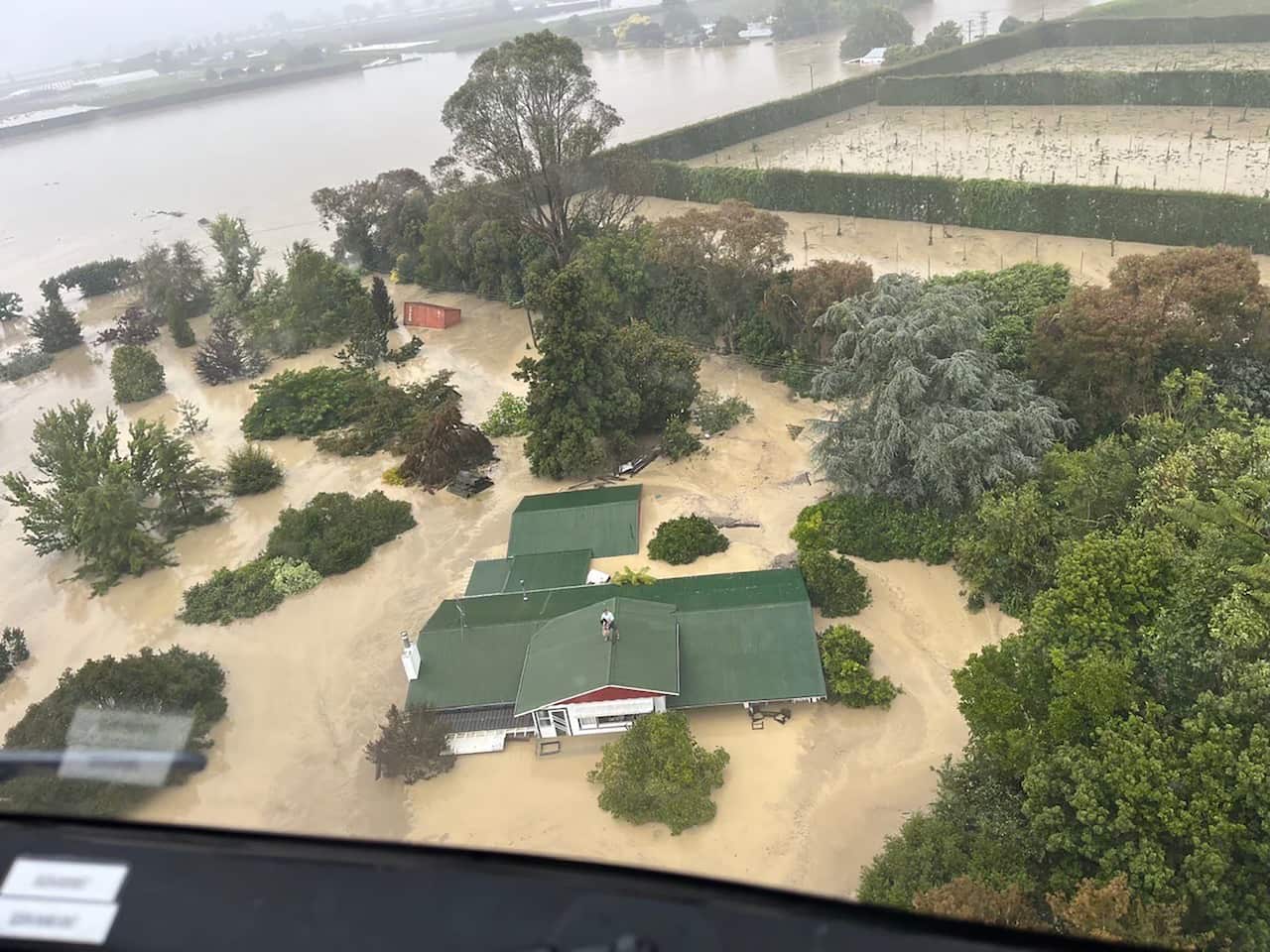 An aerial view of a flooded house.