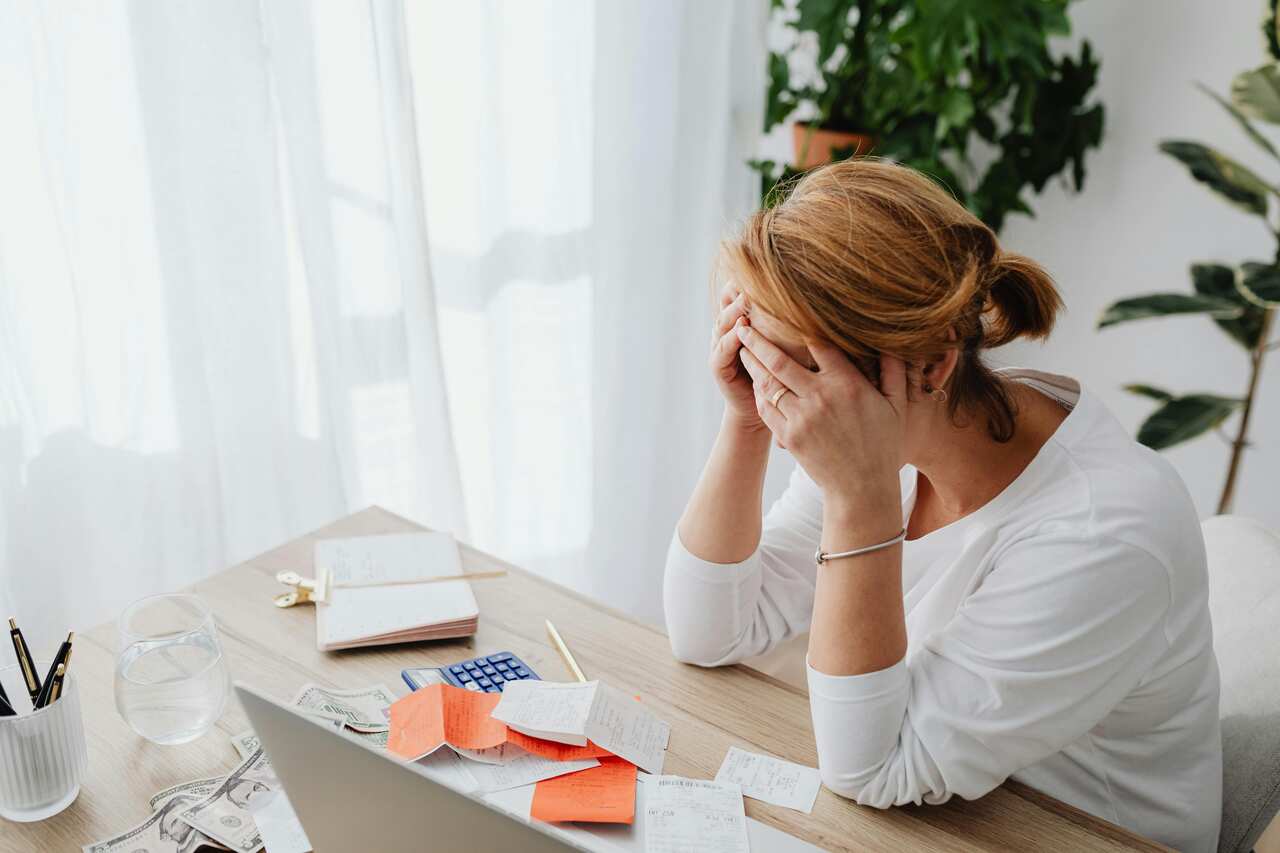 Woman and Receipts on Desk.jpg
