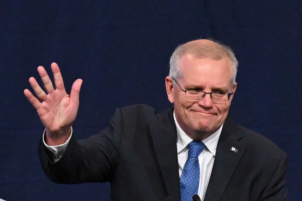 Outgoing Prime Minister Scott Morrison waves to the crowd after conceding election defeat.