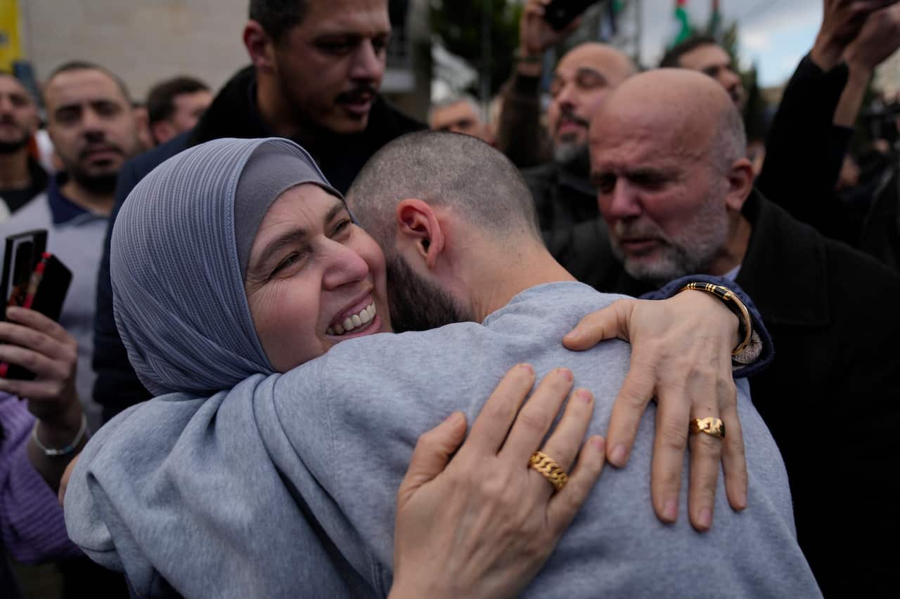 A woman hugging a man