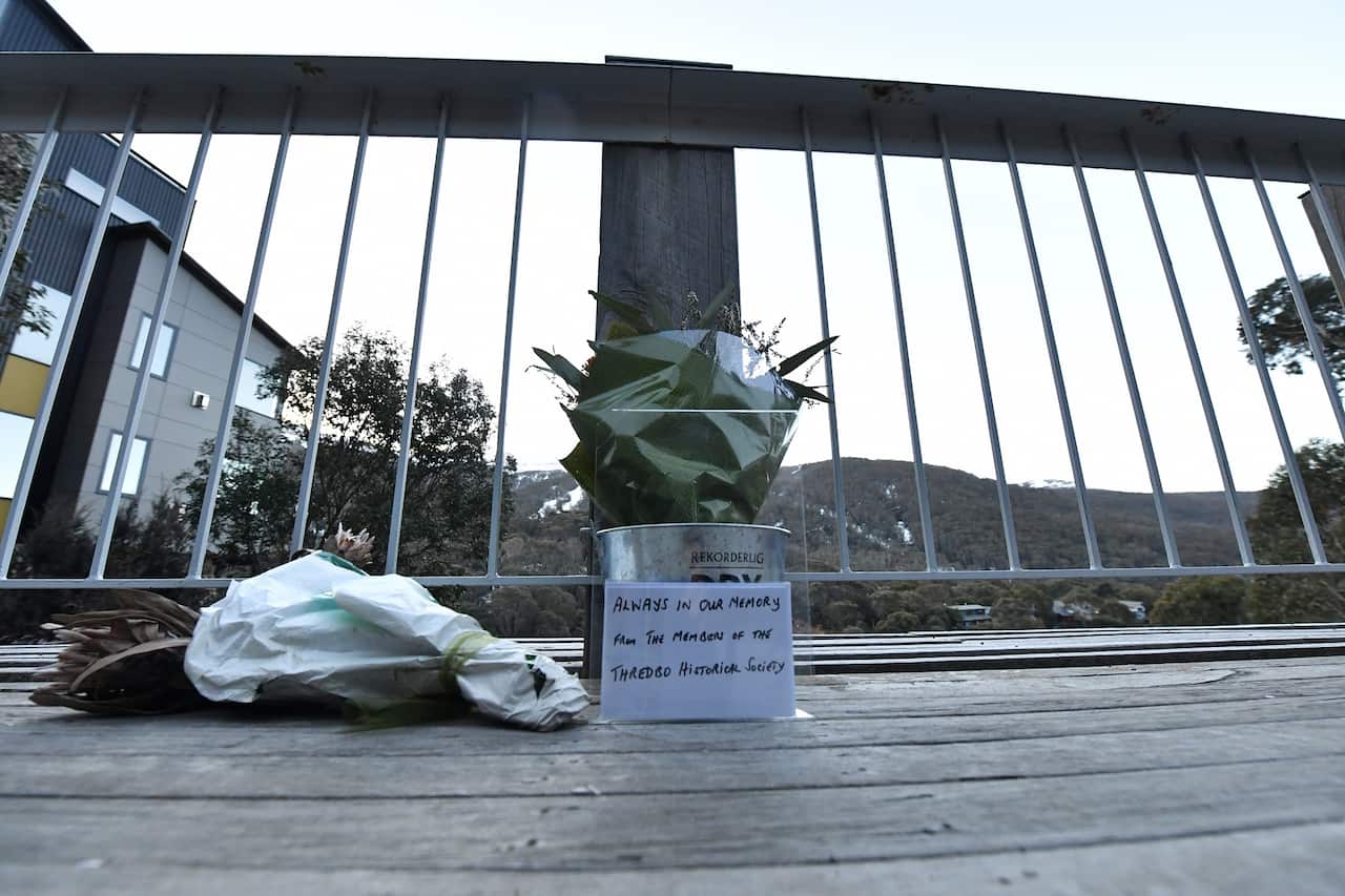 Flowers are seen at the memorial site of the Thredbo landslide at the Thredbo Alpine Village.