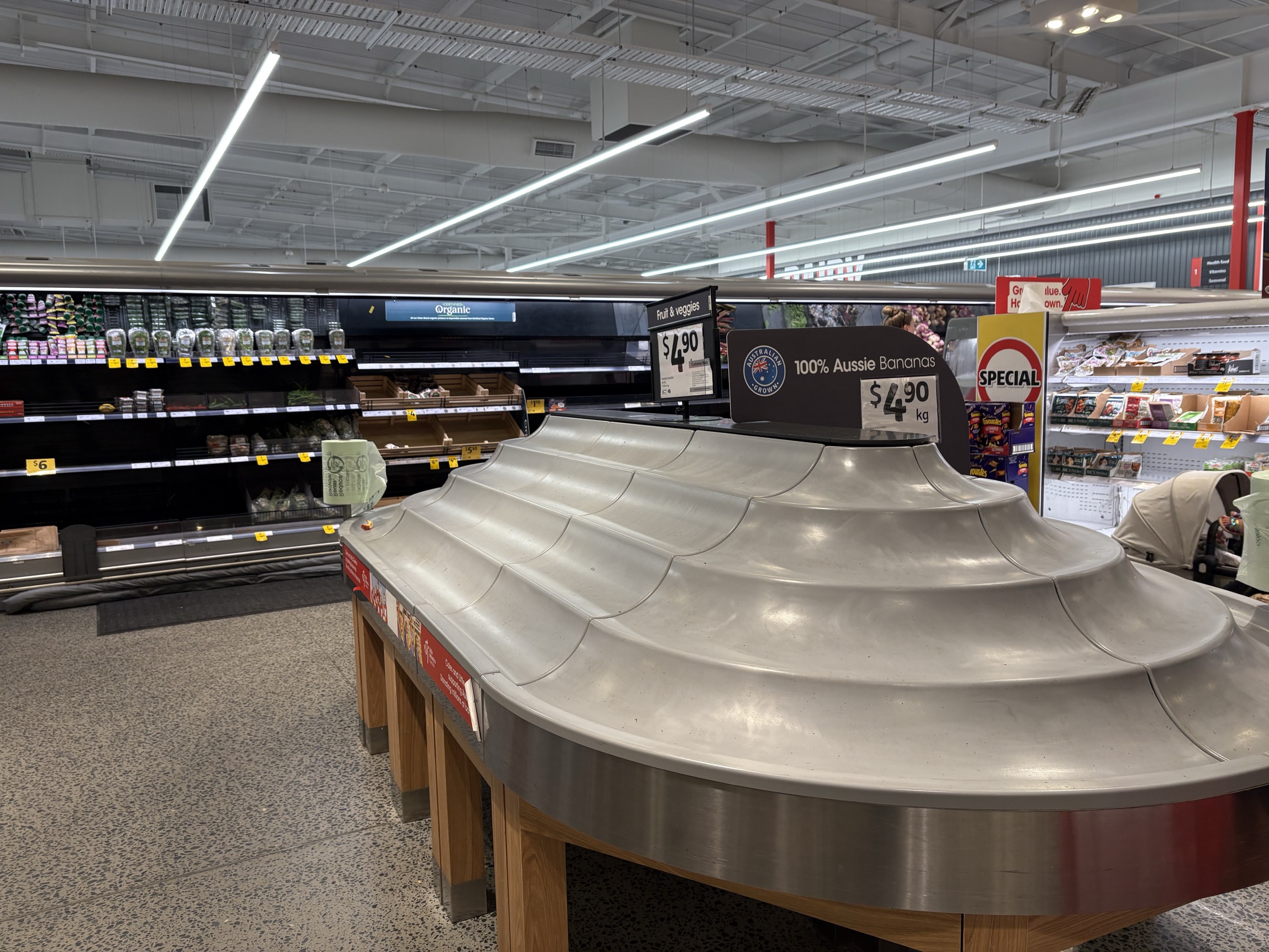Empty produce shelves in a supermarket.