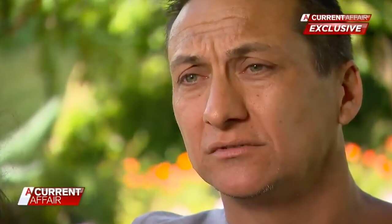 A screenshot of a man being interviewed