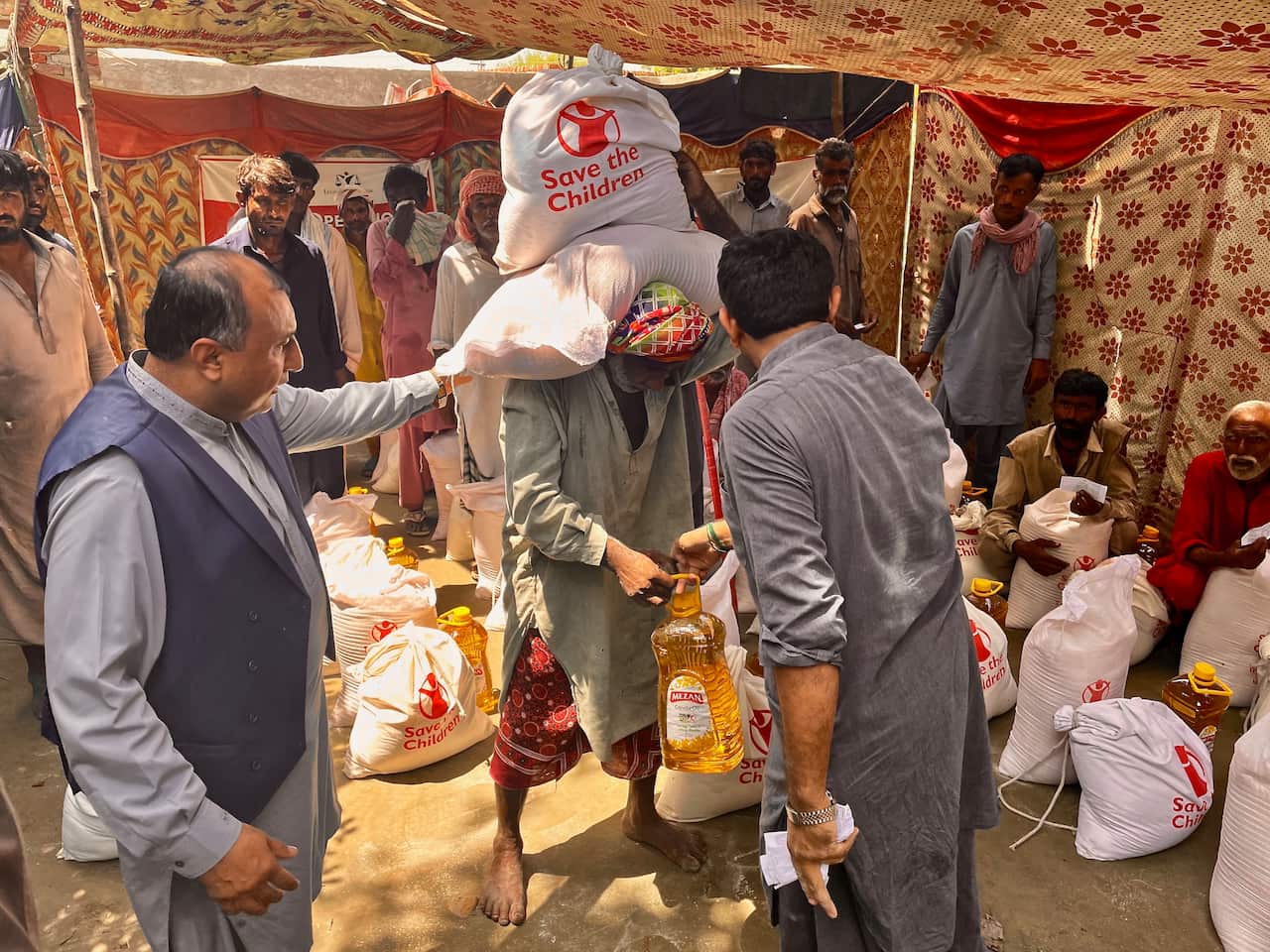Legal Rights Forum CEO Tahir Iqbal Malik distributes aid.jpg