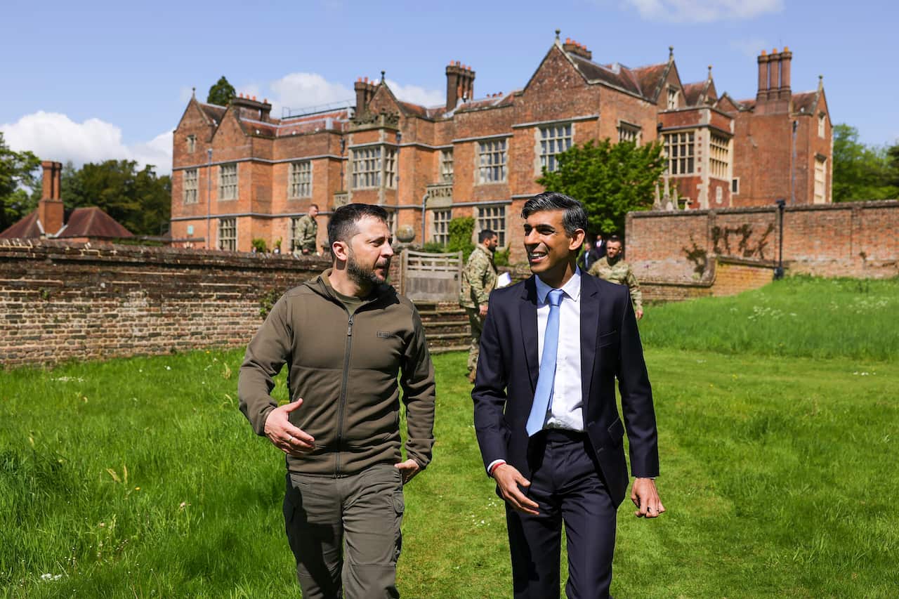 Two men walking outside.