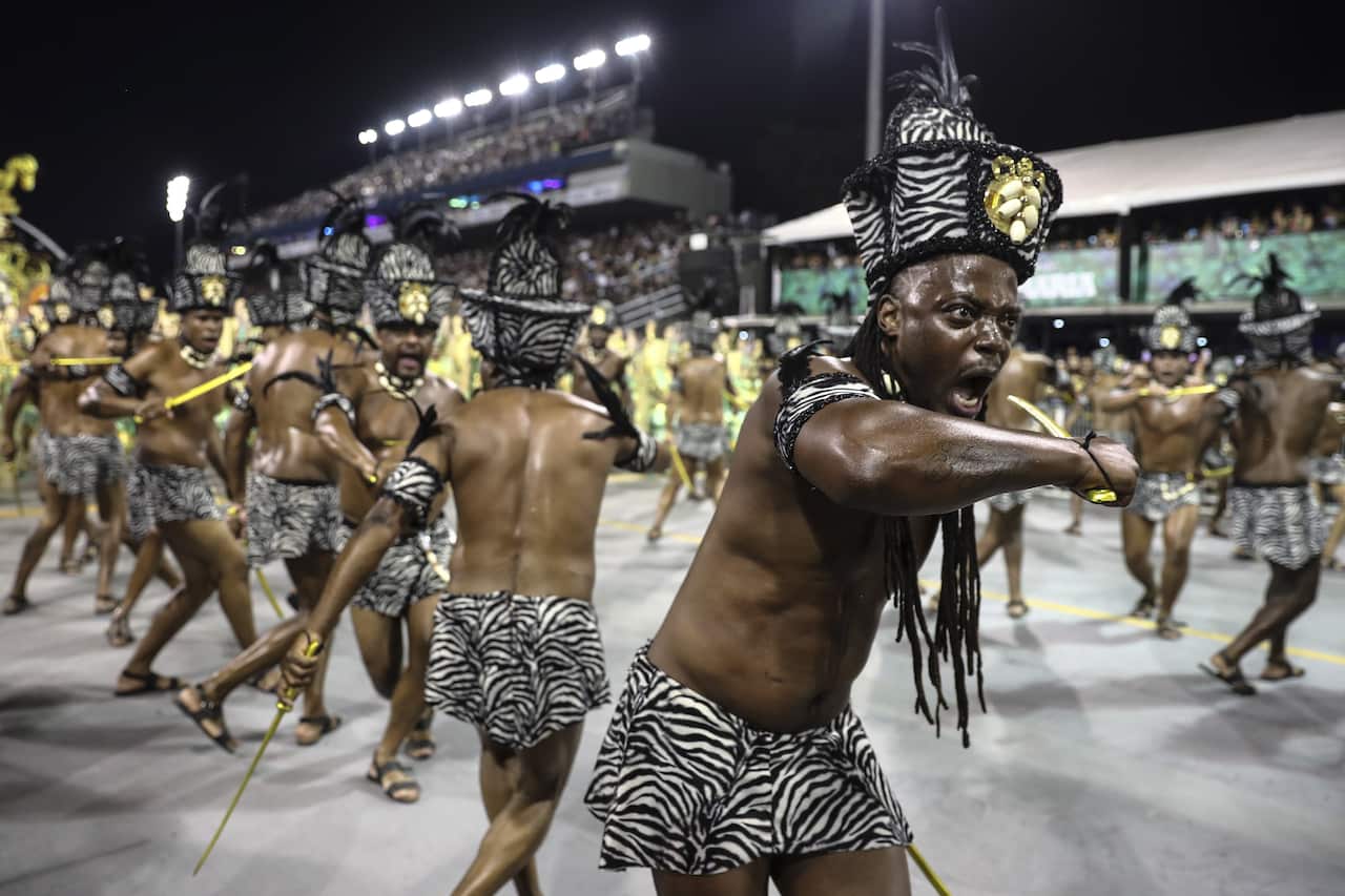 Samba dancers on a street during Rio de Janeiro's carnival.