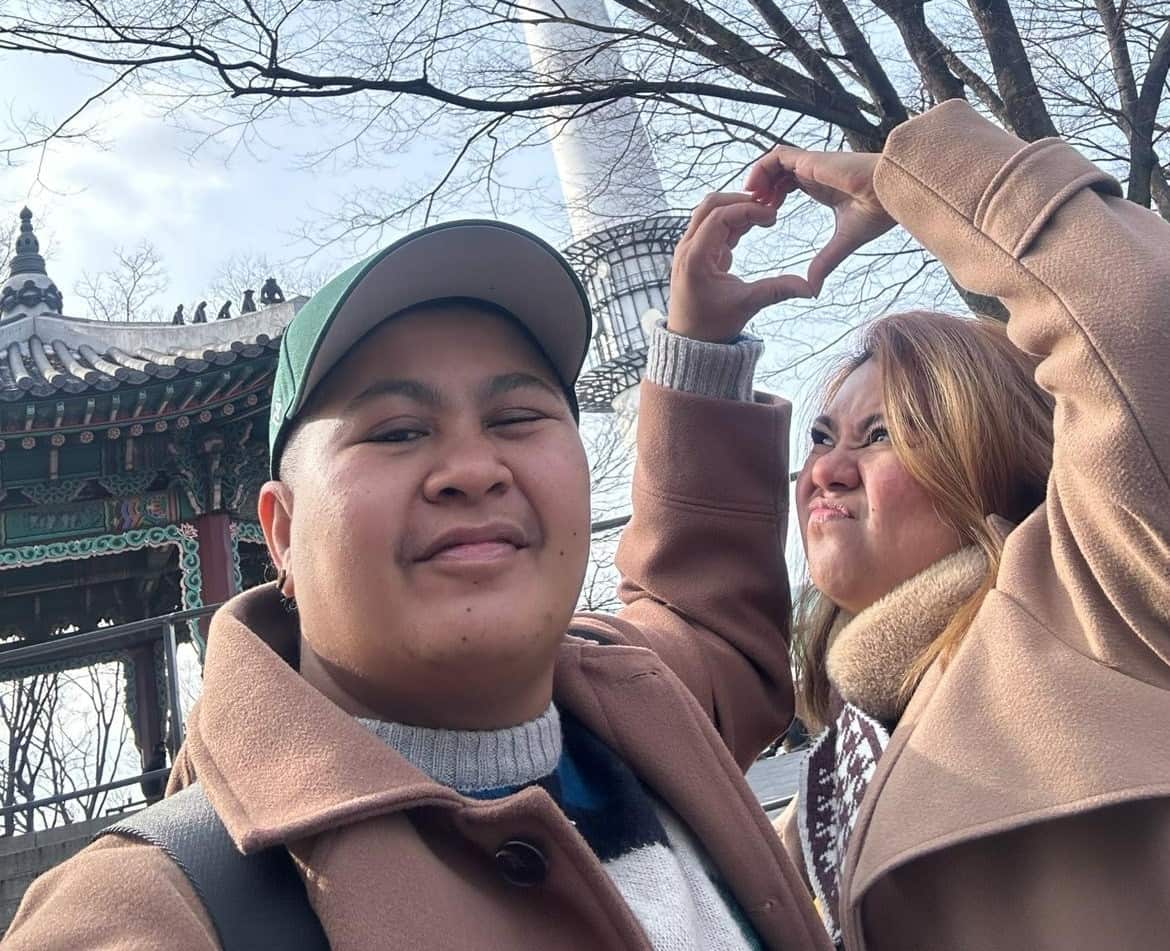 Two women in winter clothing take a selfie