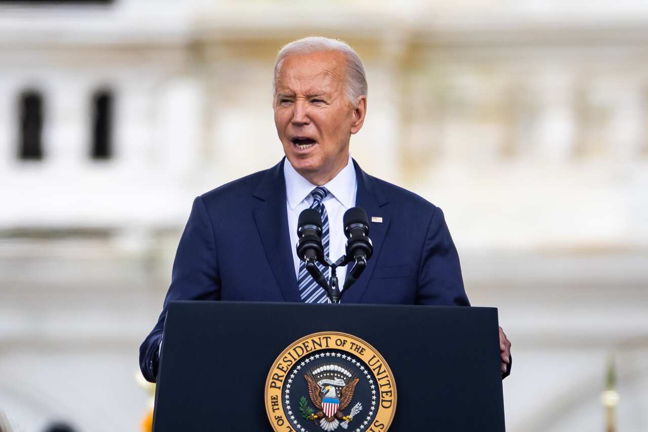 US President Joe Biden speaking at a podium.