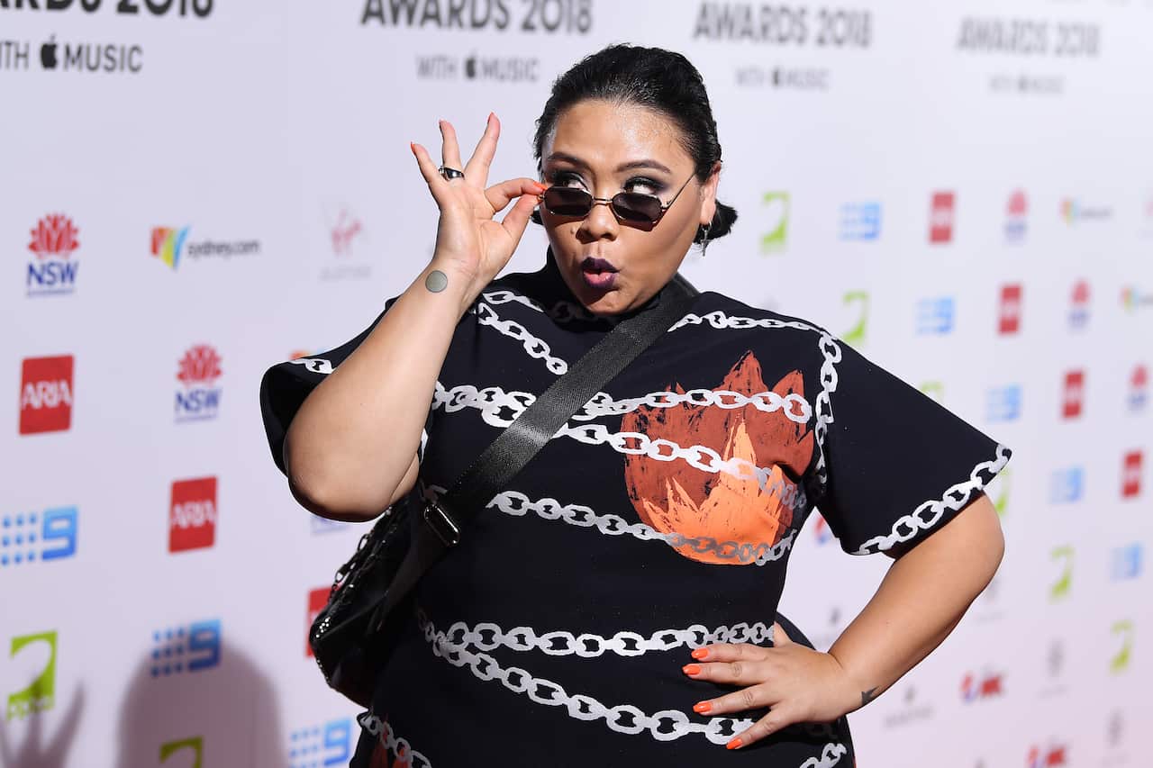 Musician Kira Puru wearing dark sunglasses  