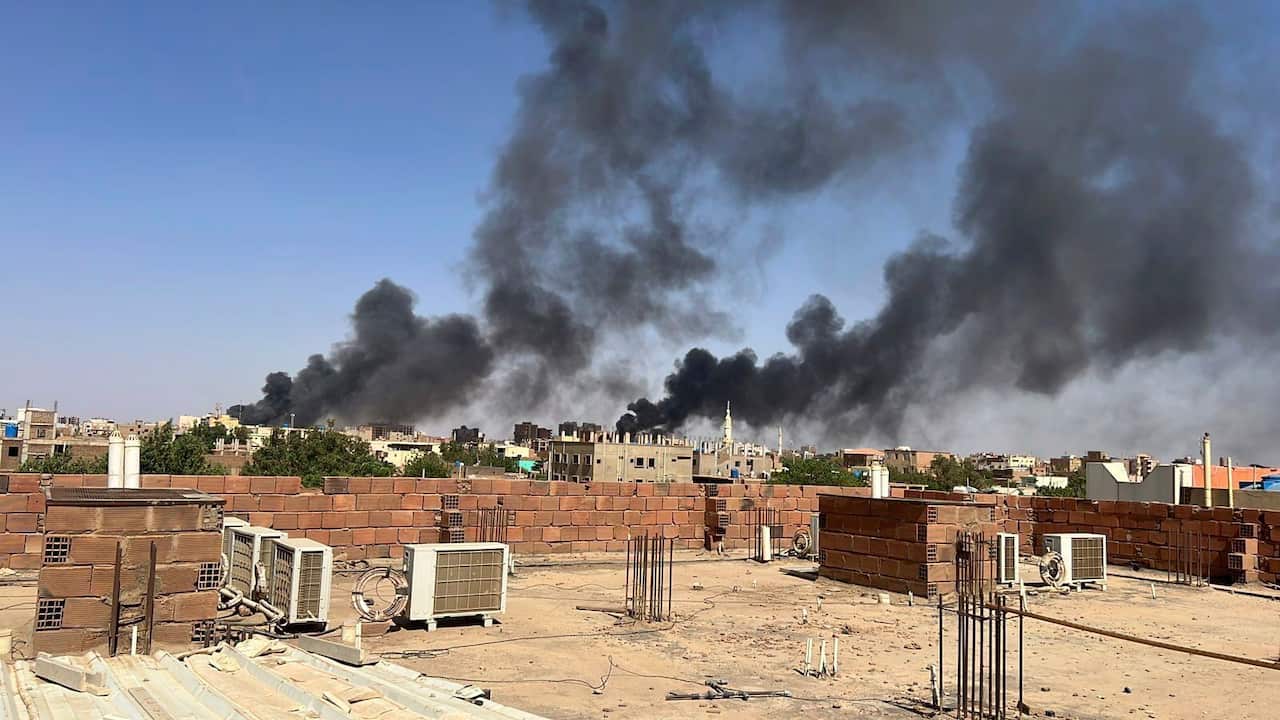 Smoke fills the sky in Khartoum, Sudan, near Doha International Hospital.