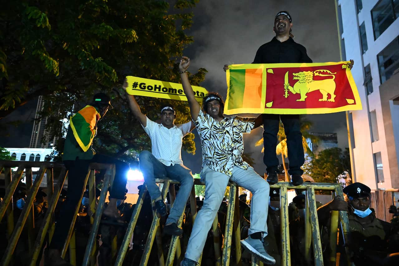 Protesters are seen gesturing.
