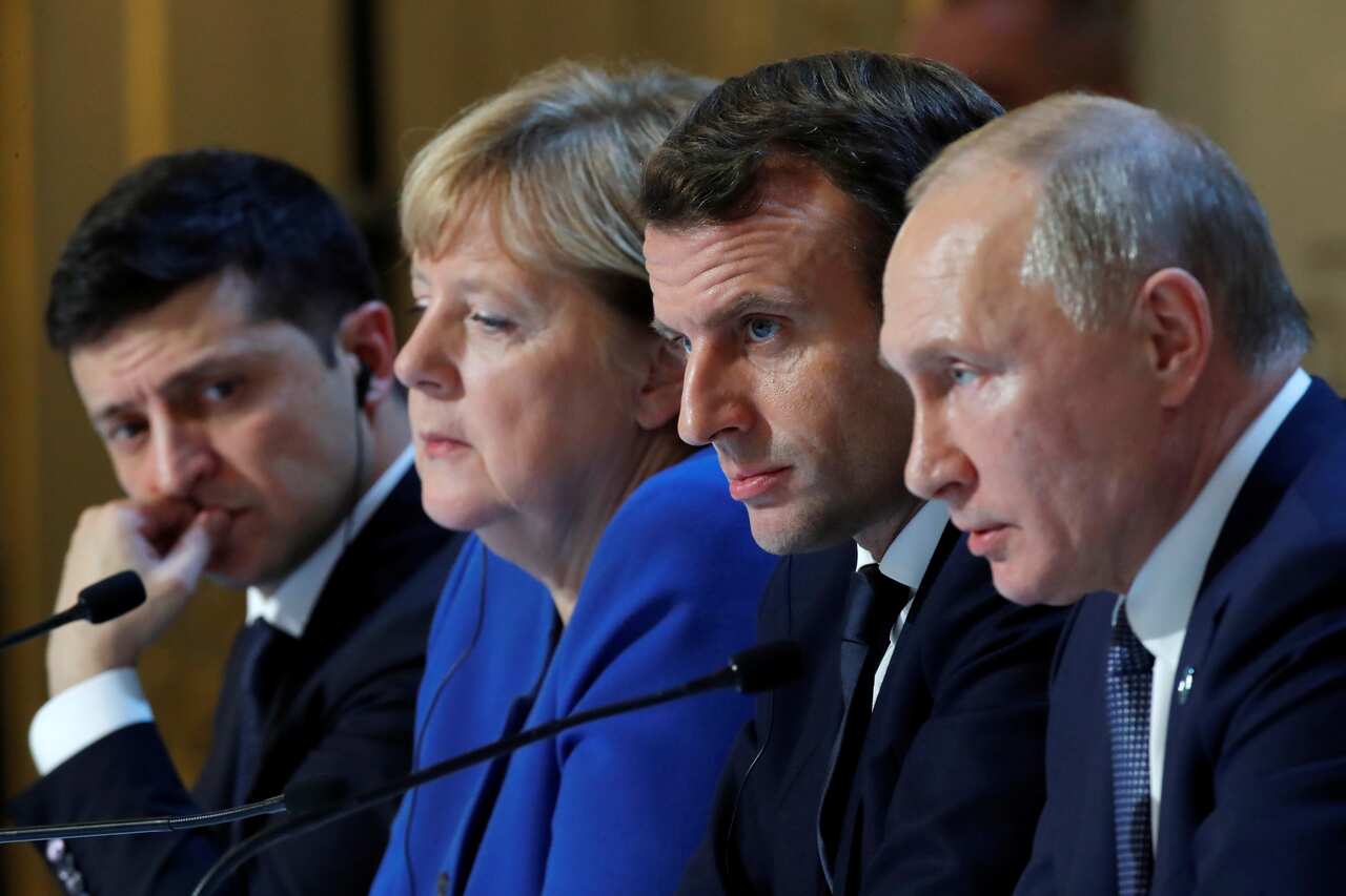 Ukraine's President Volodymyr Zelenskyy, German Chancellor Angela Merkel, French President Emmanuel Macron and Russia's President Vladimir Putin attend a press conference in 2019.