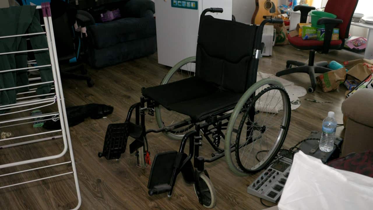 An empty wheelchair in a room