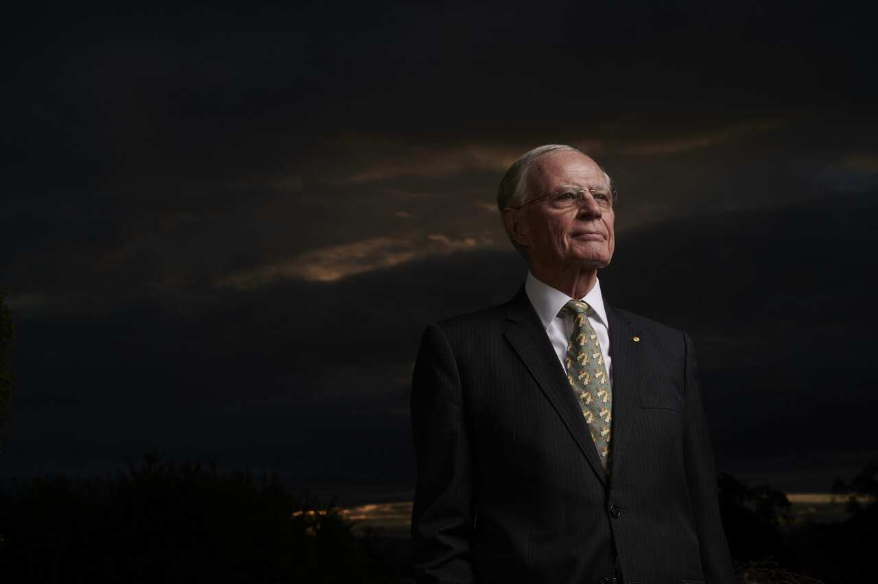 Former Chief of the Australian Defence Force Chris Barrie wearing a suit and standing outside against dark sky