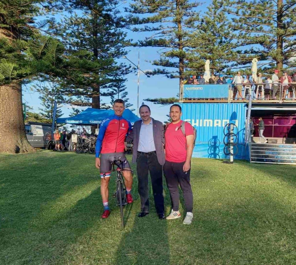 Cyclist Ognjen Ilic and his coach with the Serbian ambassador Rade Stefanovic in Wollongong
