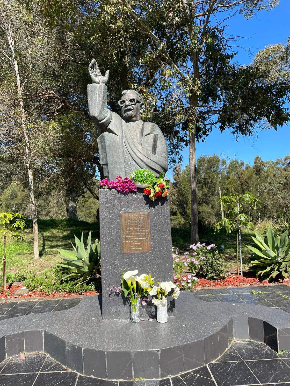 Chilean-Australians place floral tributes at a statue of Salvador Allende to mark the people who died during the military regime under General Augusto Pinochet.