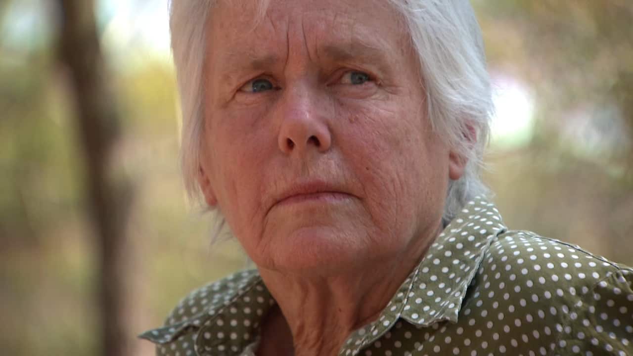 Close-up of a woman's face looking worried 