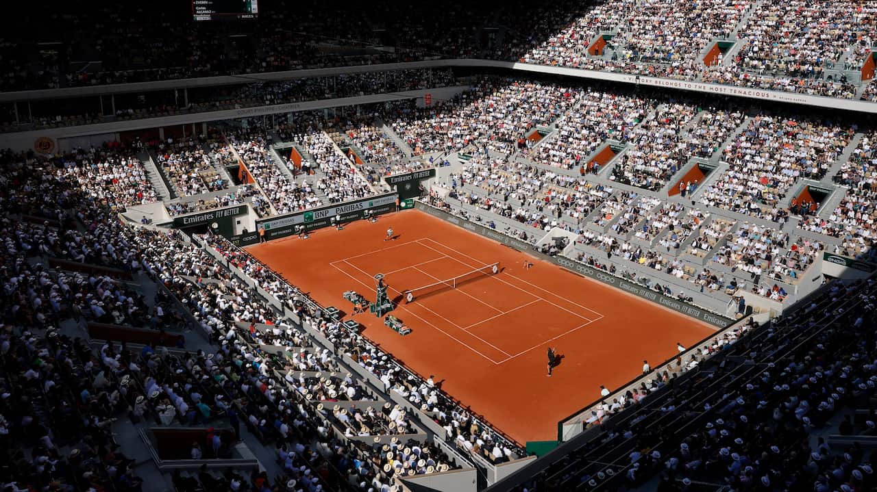 The crowd watch Spain's Carlos Alcaraz playing Germany's Alexander Zverev during their quarterfinal match at the French Open.A