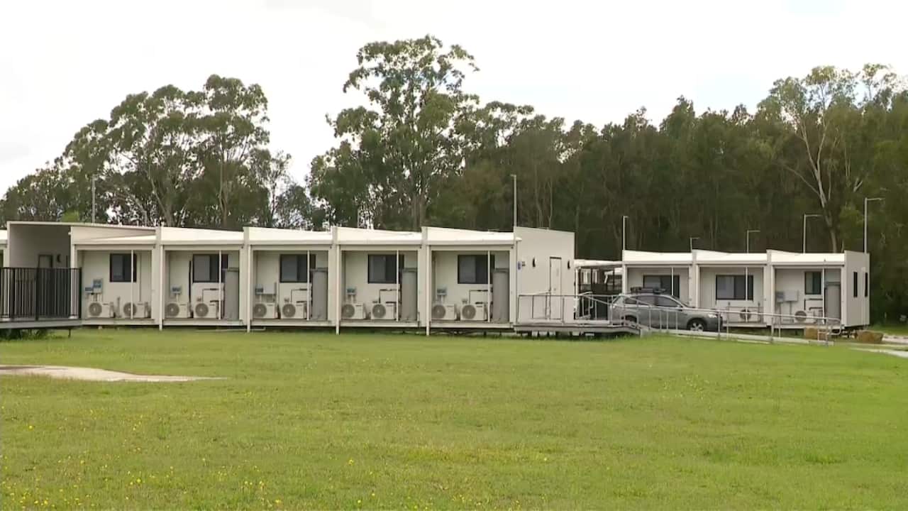 Shipping container style pods line a strip. 