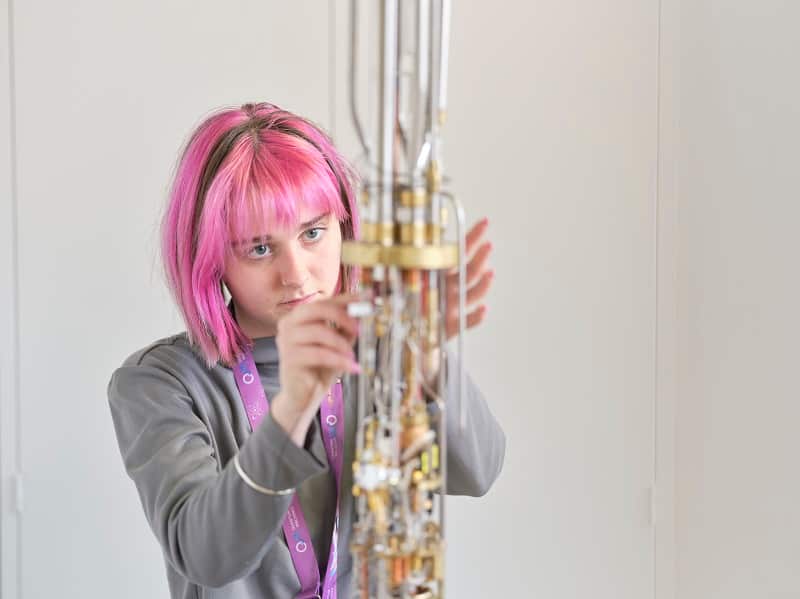 Woman works on equipment. 