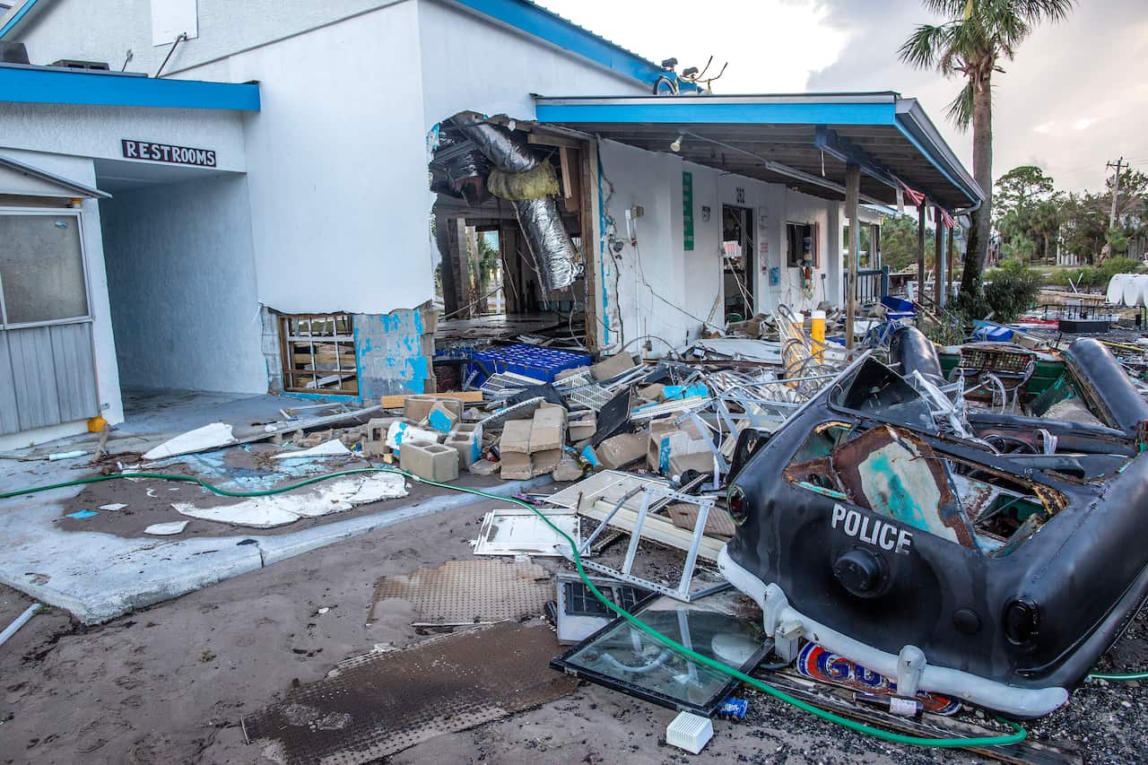 A few buildings and a police vehicle destroyed by a hurricane.