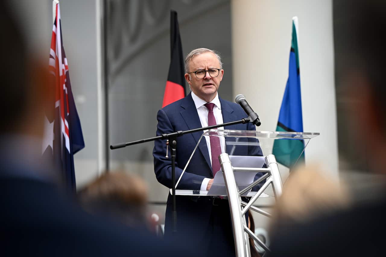 A man speaks at a press conference.