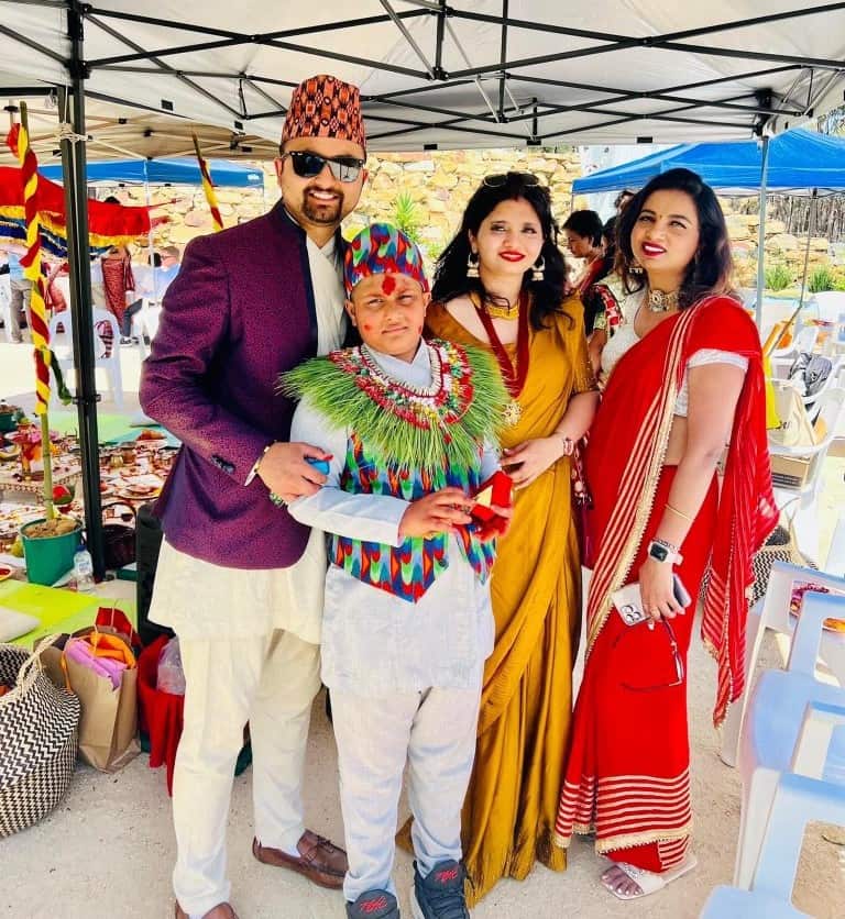 Ankita Upreti (R) and her son Savio Acharya (C) with family during the bratabandha program in Brishti Ganesh temple.