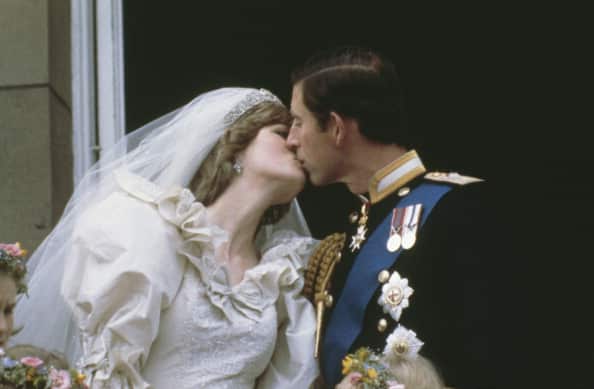 Princess Diana and Prince Charles kiss after their wedding in 1981.