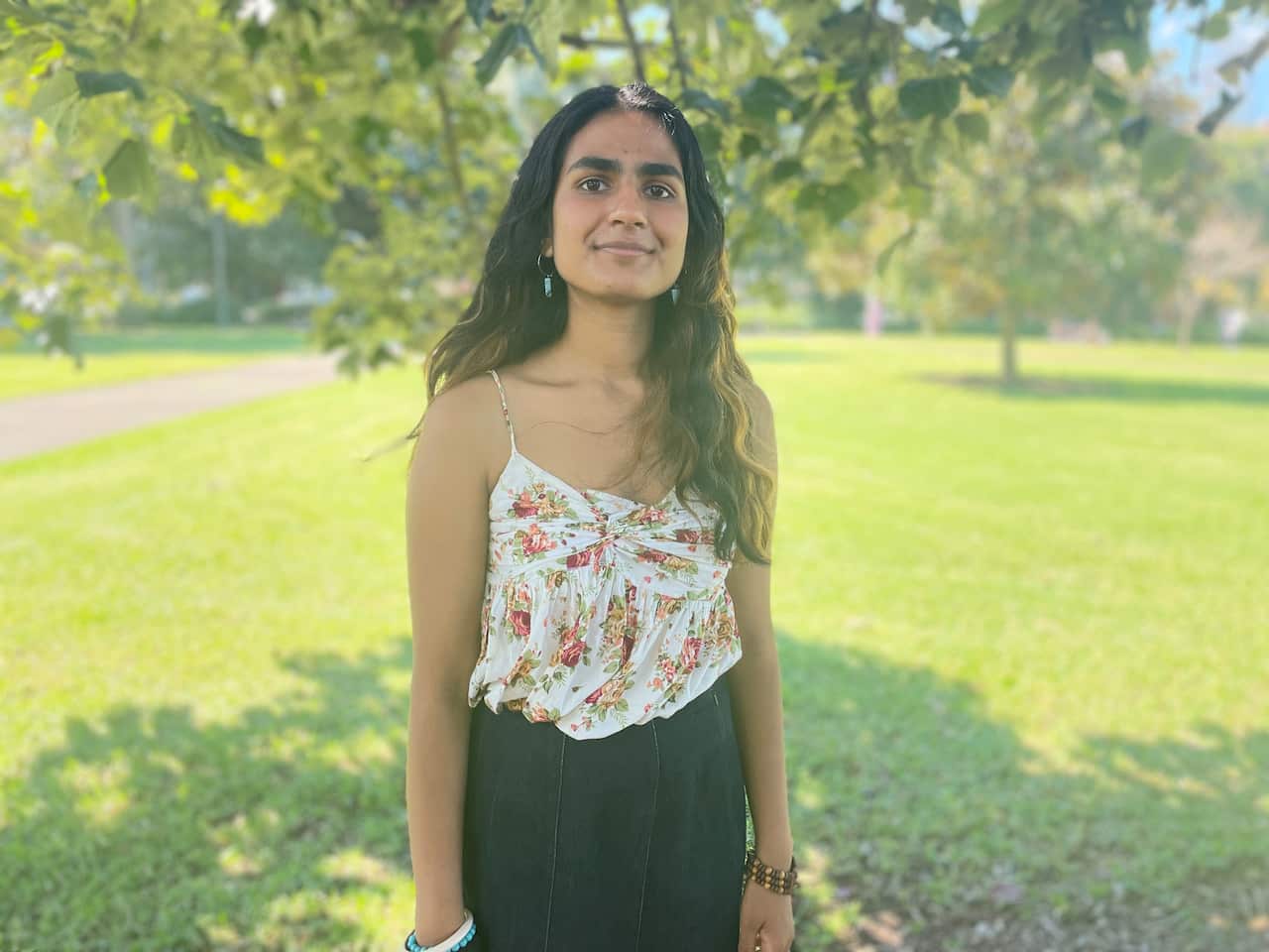 Varsha Yajman stands in a park in Sydney
