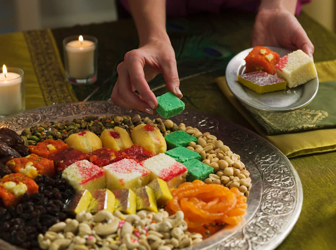 Person with platter of Diwali sweets