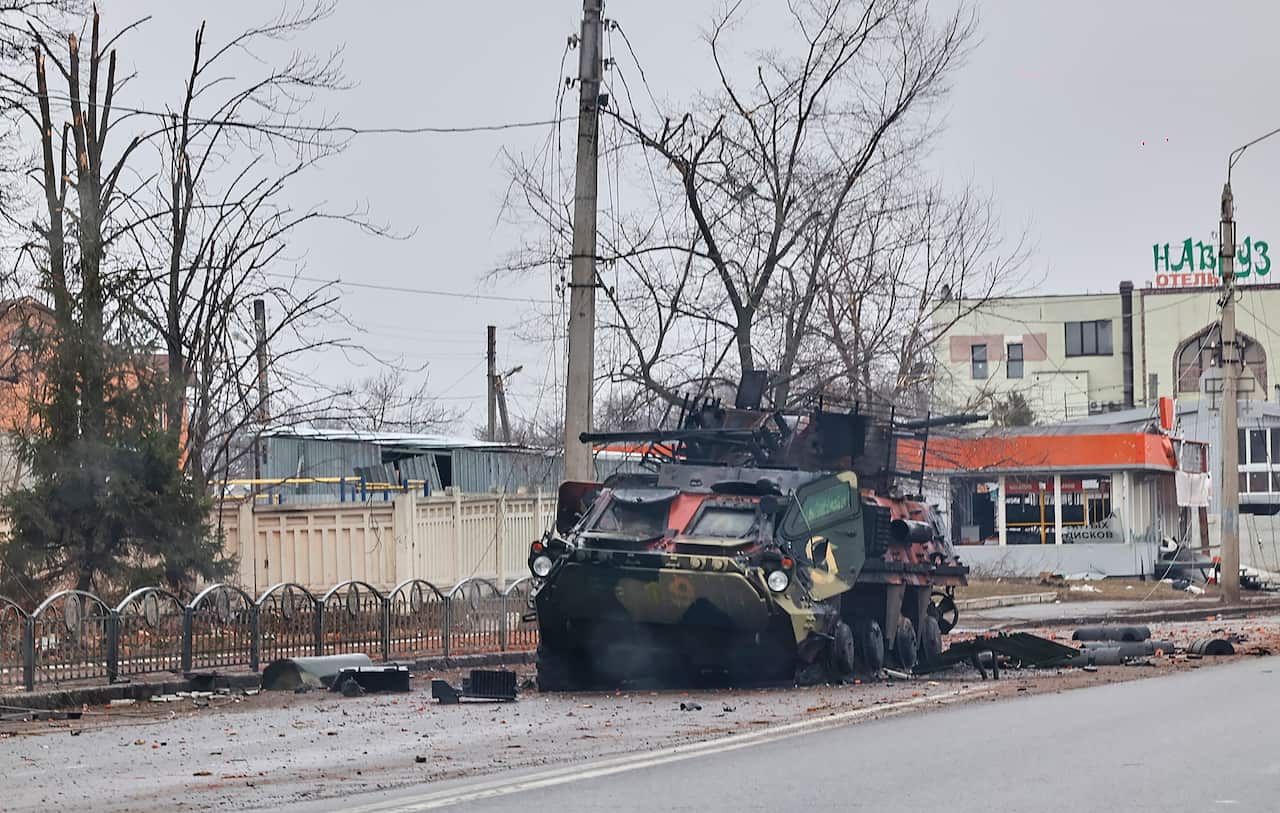 A damaged armoured vehicle is seen on a street in Ukraine.