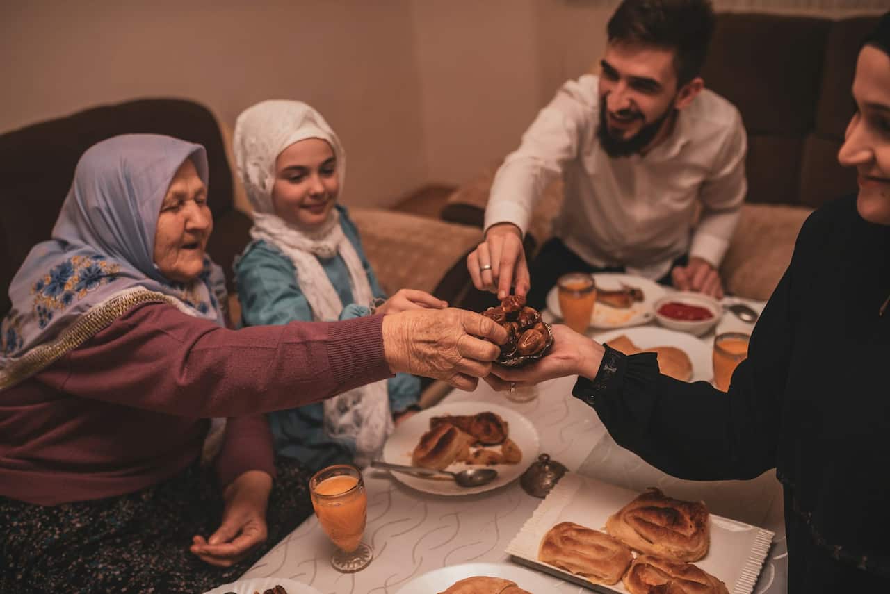 Four people sharing a meal.