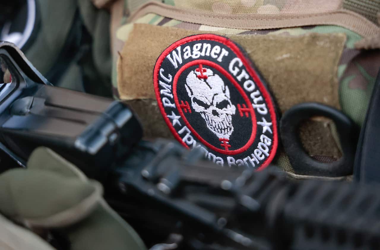 A Wagner Group logo badge on a military uniform.