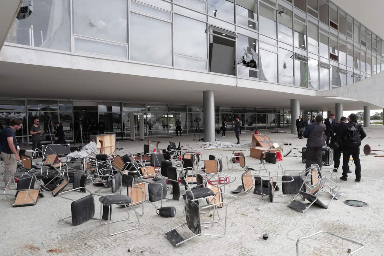 Officials inspect the damage to the Planalto Palace after Bolsonaro supporters took over the Plaza de los Tres Poderes (Square of the Three Powers) to invade government buildings, in Brasilia, Brazil, 09 January 2023.