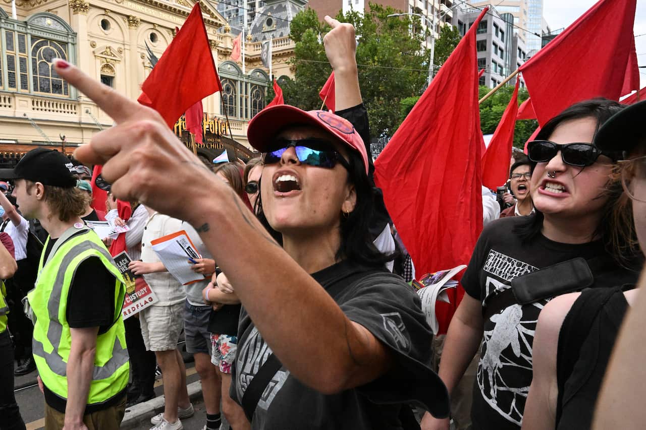 Transgender rights supporters clash with neo-Nazi protesters in Melbourne on Saturday.