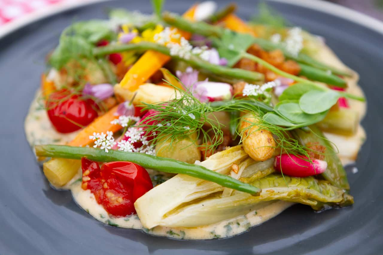 Spring garden vegetables with herb emulsion