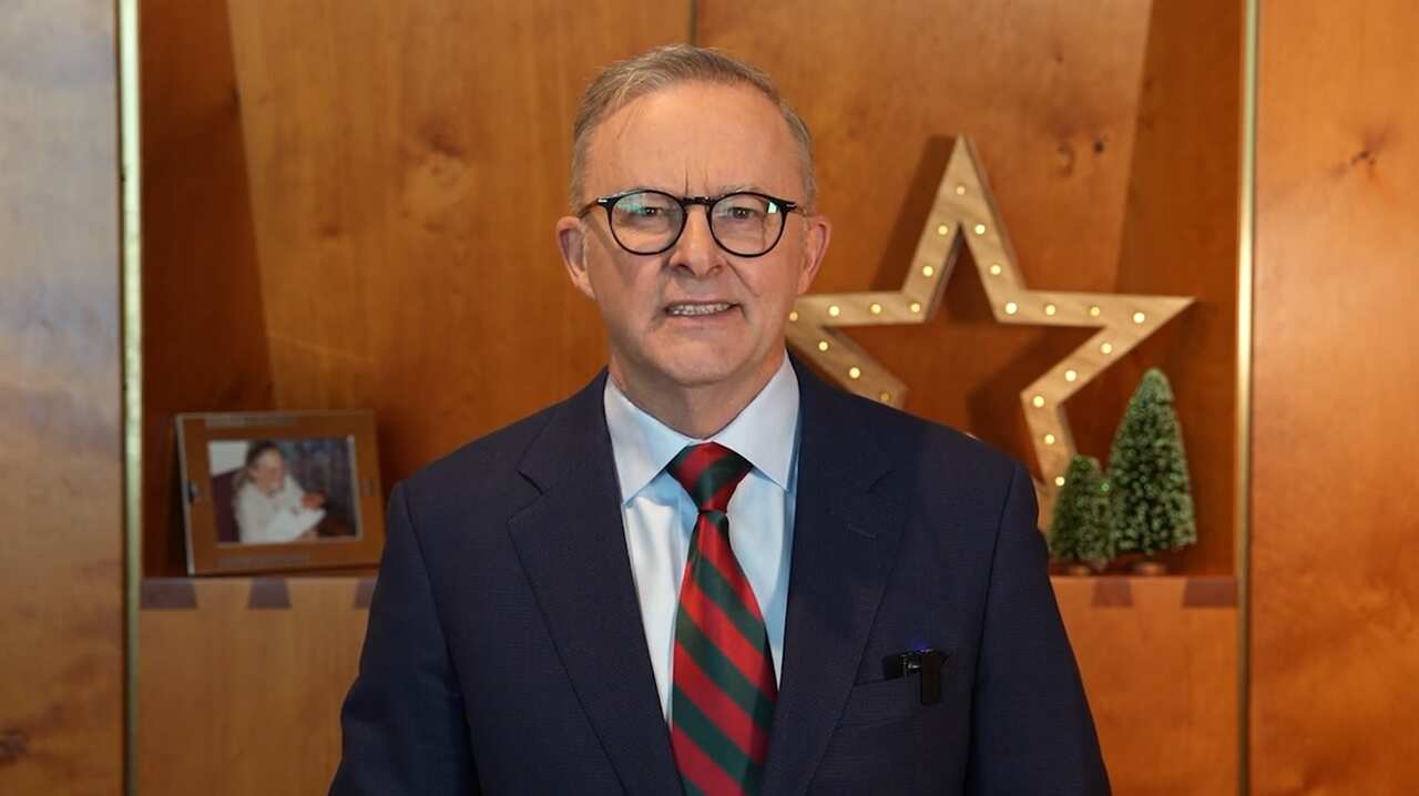 Anthony Albanese in his office delivering a Christmas message.