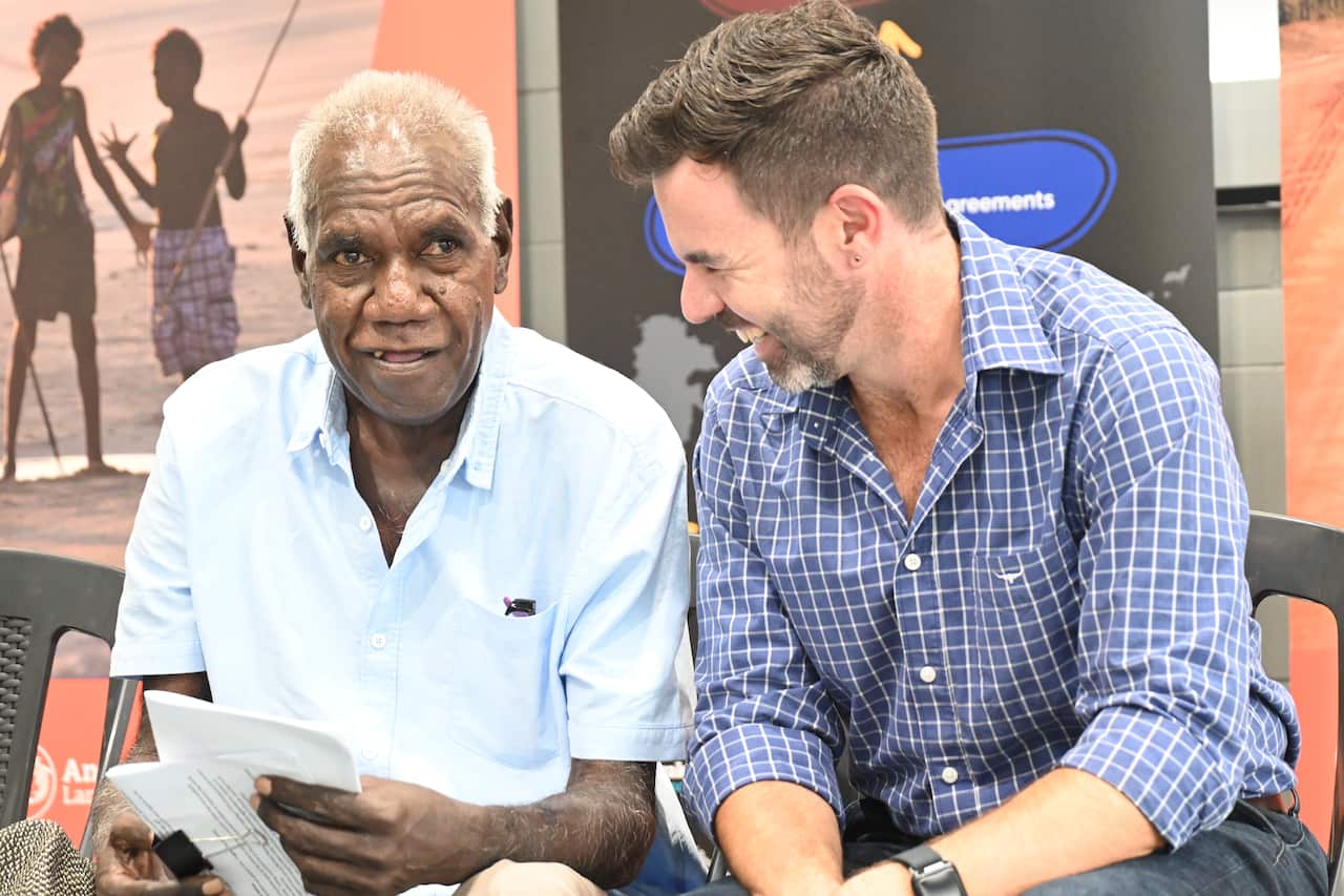 Anindilyakwa Land Council Chairman Tony Wurrmarrba (Left) sits with the NT Attorney-General Chansey Paech