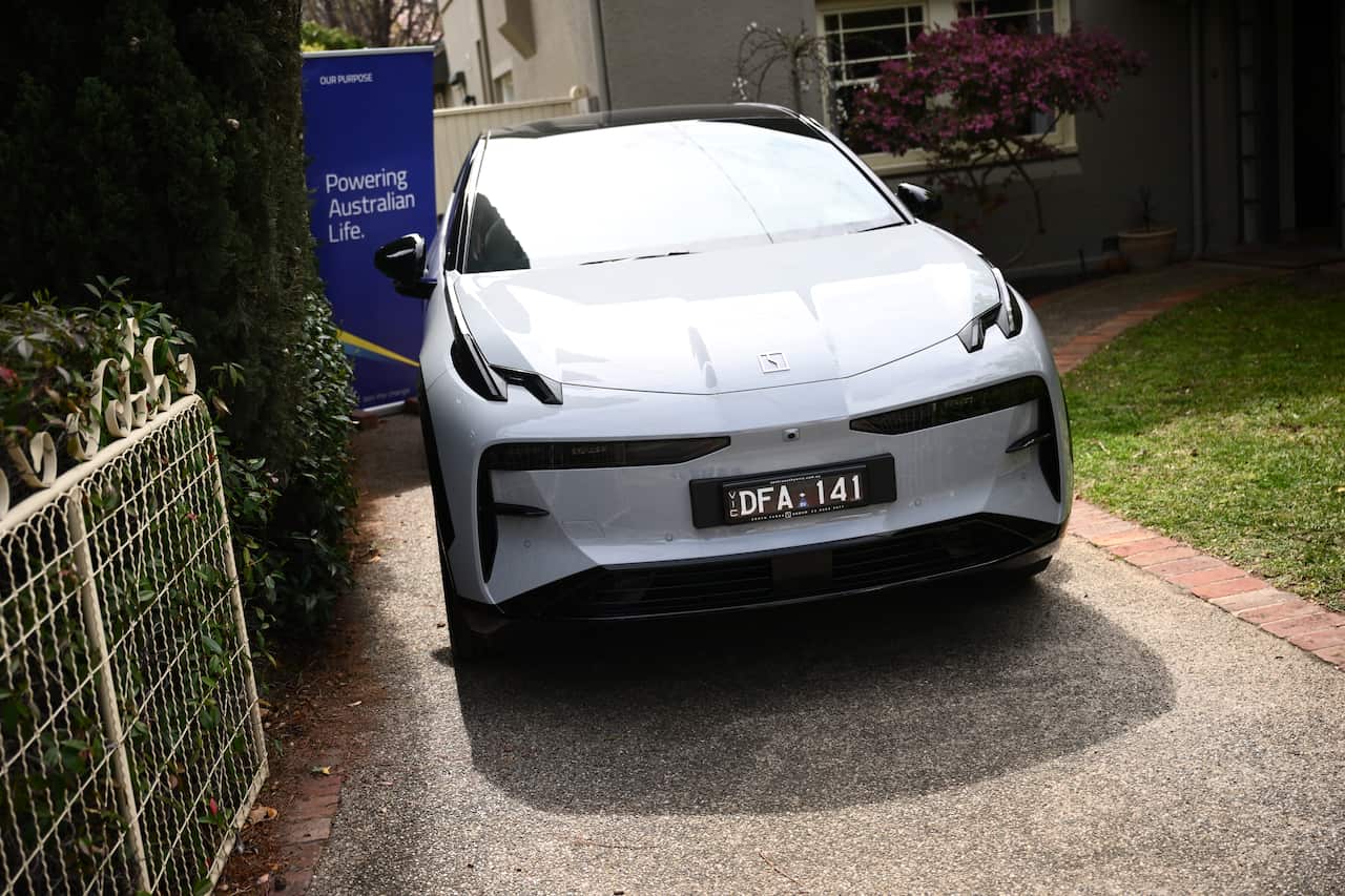 An EV parked in a driveway