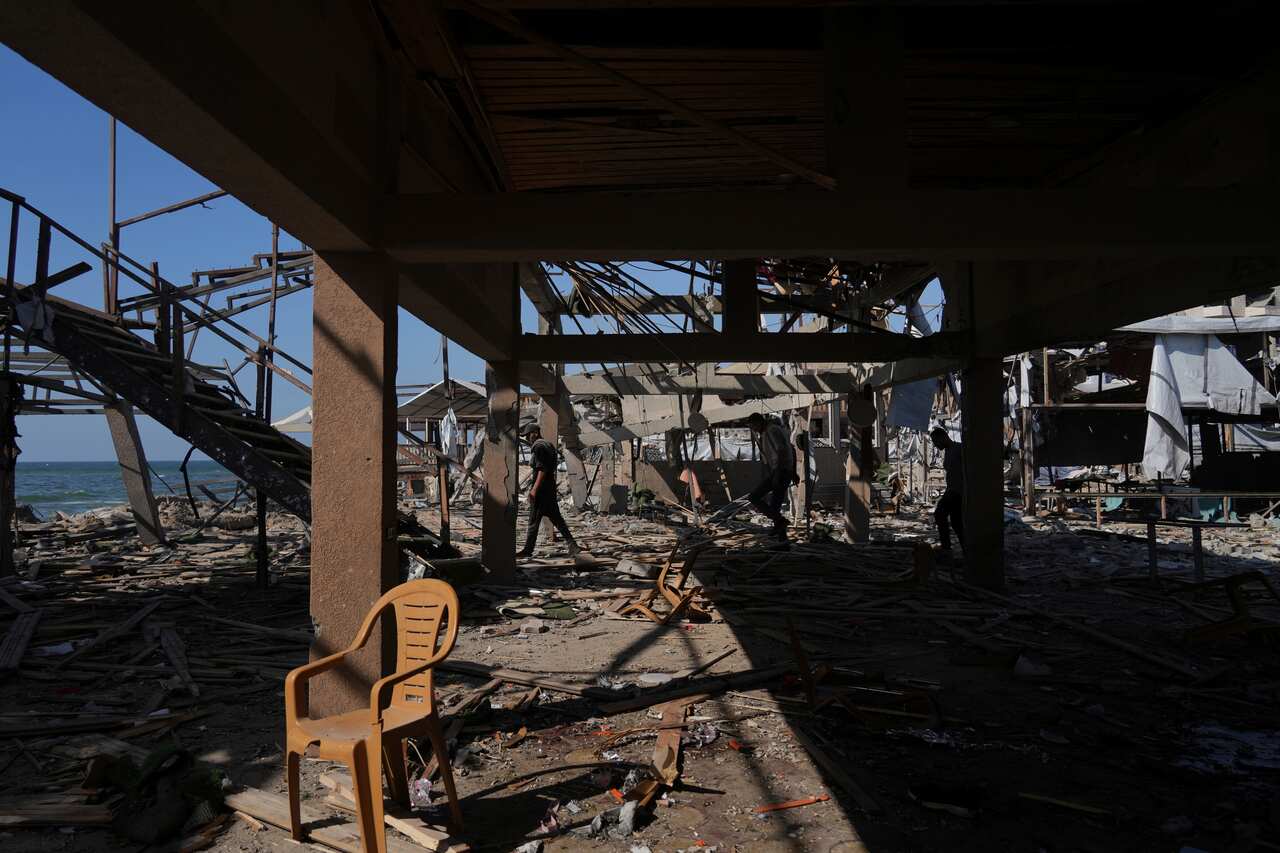 A chair in the centre of a destroyed building