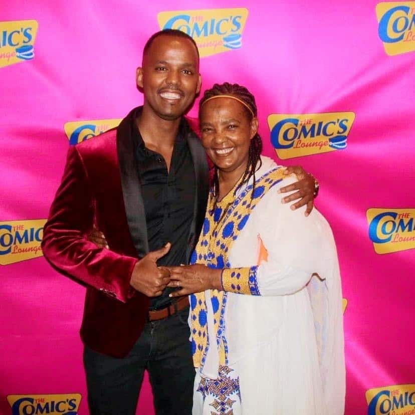 Joe White standing with his arm around his mother