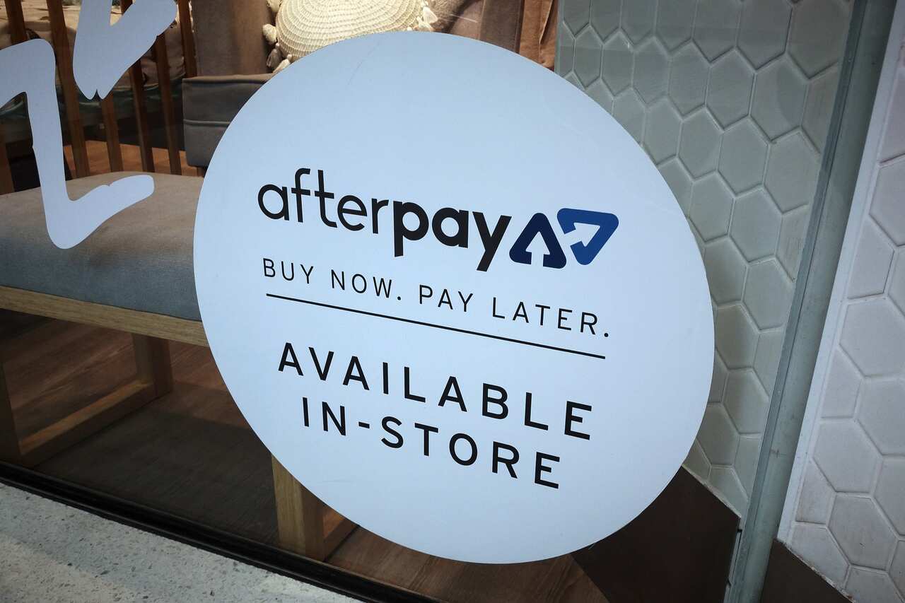 An Afterpay sign on a window.